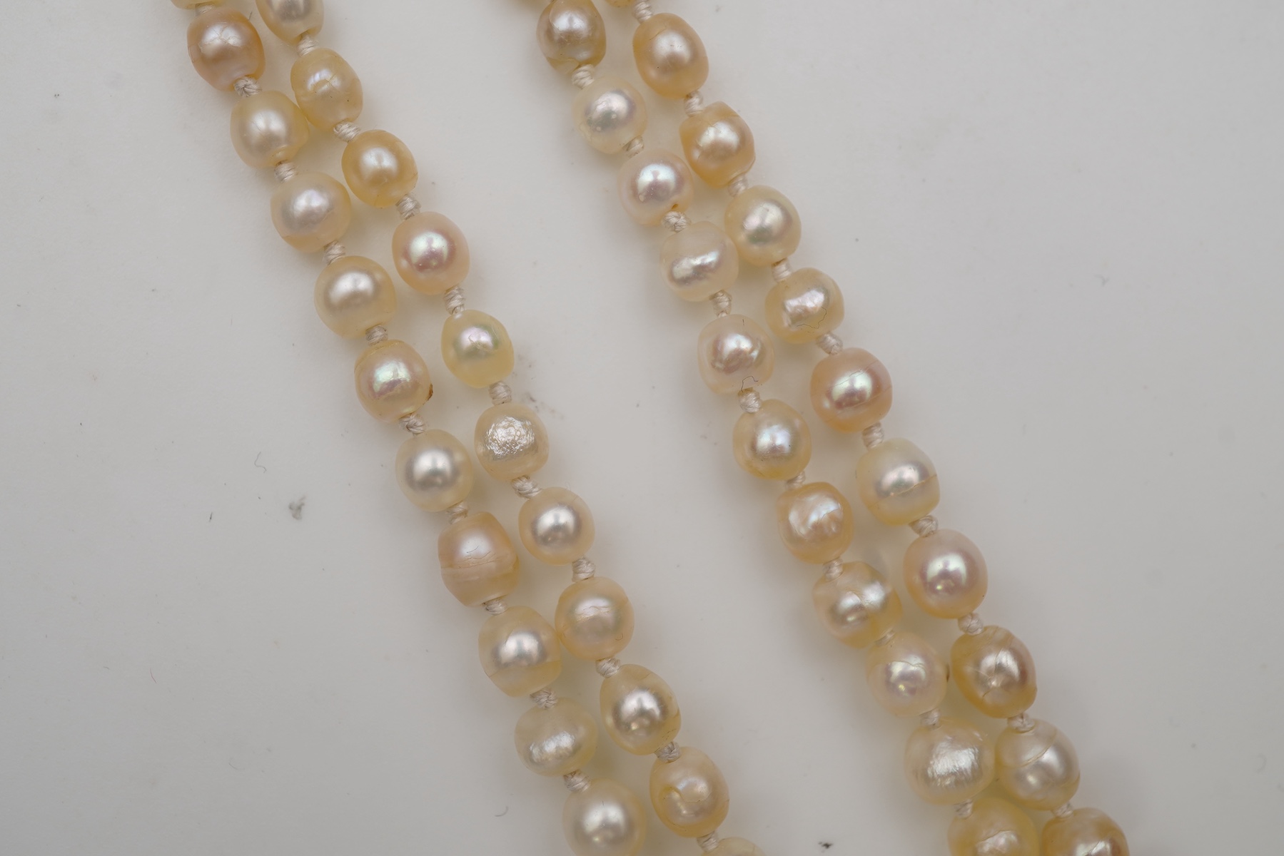 A natural pearl and diamond necklace, early 20th century
